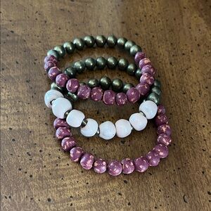 Elegant Trades of Hope Beaded Bracelet Set - Pink, White, and Burgundy.
